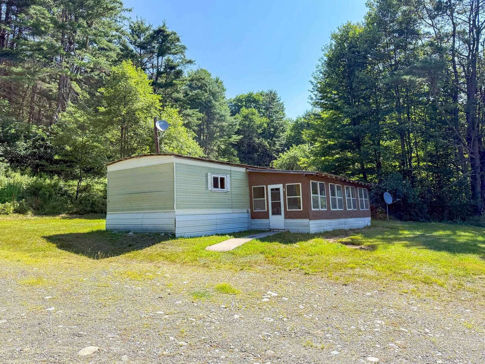5.2 Acres of Land with Home for Sale in Lisbon, New Hampshire