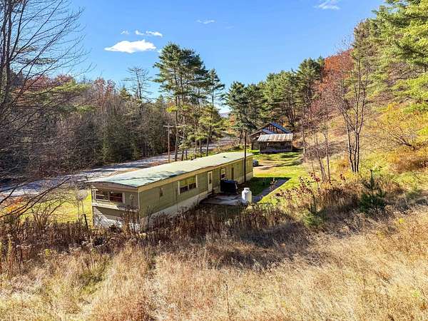 5.2 Acres of Land with Home for Sale in Lisbon, New Hampshire