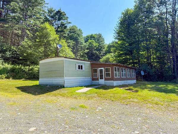5.2 Acres of Land with Home for Sale in Lisbon, New Hampshire