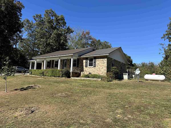 2.4 Acres of Residential Land with Home for Sale in Crump, Tennessee