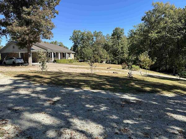 2.4 Acres of Land with Home for Sale in Crump, Tennessee