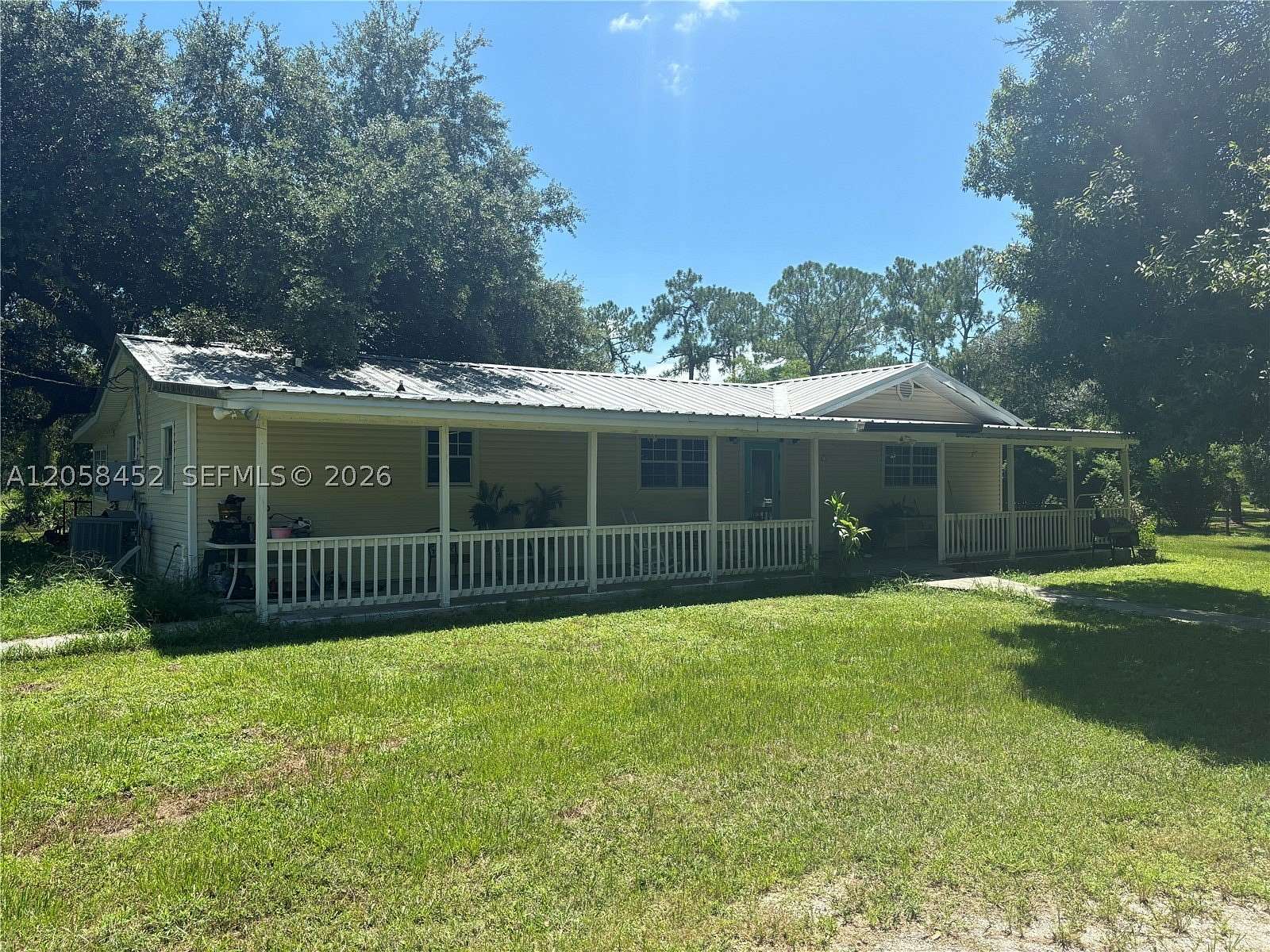 4.85 Acres of Land with Home for Sale in Moore Haven, Florida