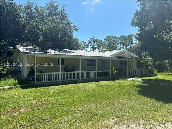 4.85 Acres of Land with Home for Sale in Moore Haven, Florida