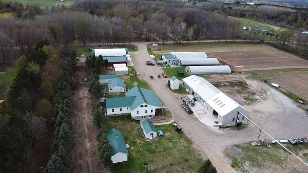 30 Acres of Agricultural Land with Home for Sale in Brethren, Michigan