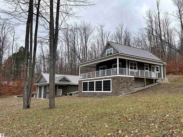 9.7 Acres of Residential Land with Home for Sale in Kalkaska, Michigan