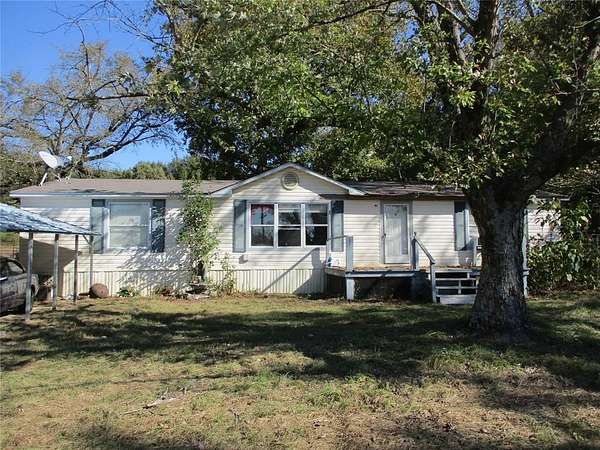 5 Acres of Residential Land with Home for Sale in Quitman, Texas