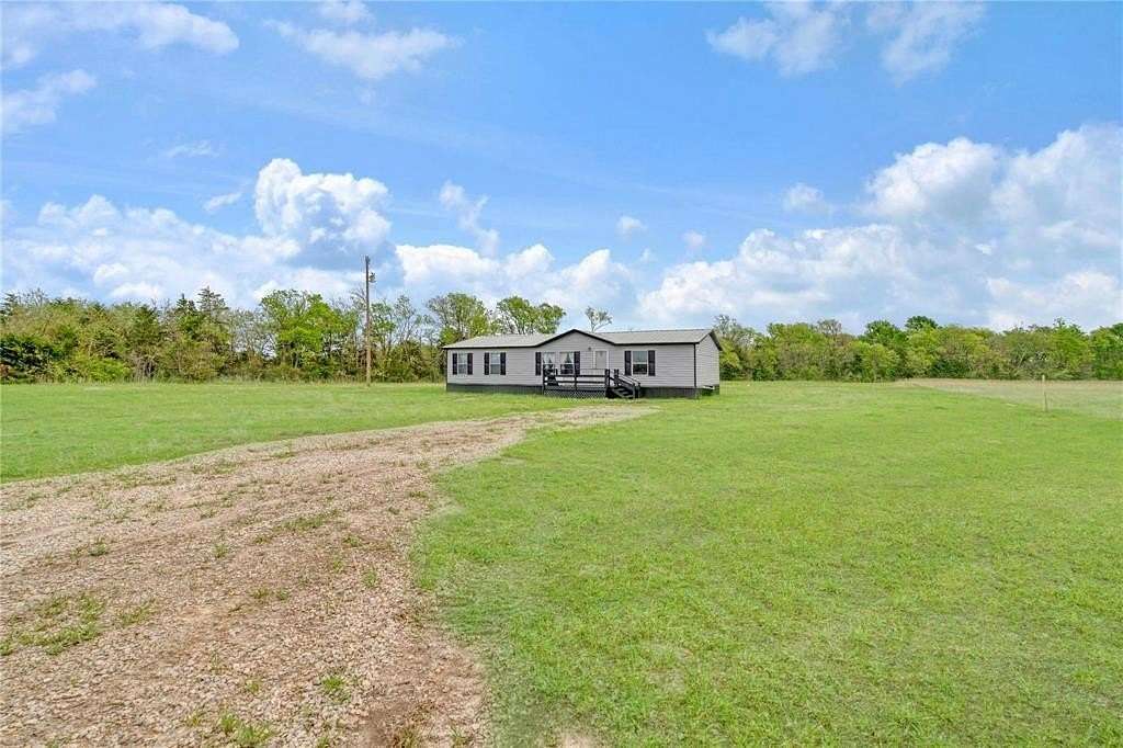 2.5 Acres of Residential Land with Home for Sale in Paris, Texas