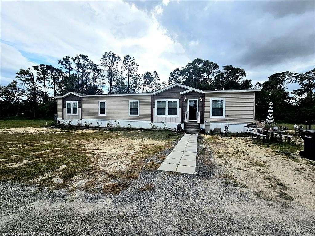 4.88 Acres of Residential Land with Home for Sale in Davenport, Florida