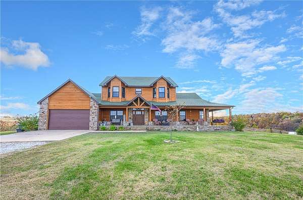 18 Acres of Land with Home for Sale in Gravette, Arkansas