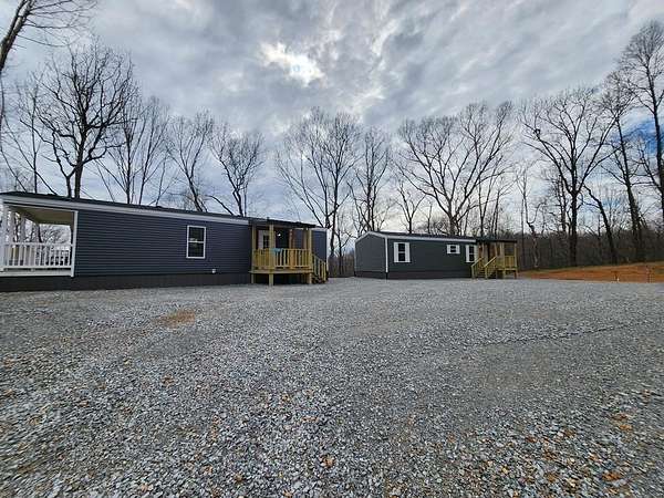 5 Acres of Residential Land with Home for Sale in Springville, Tennessee