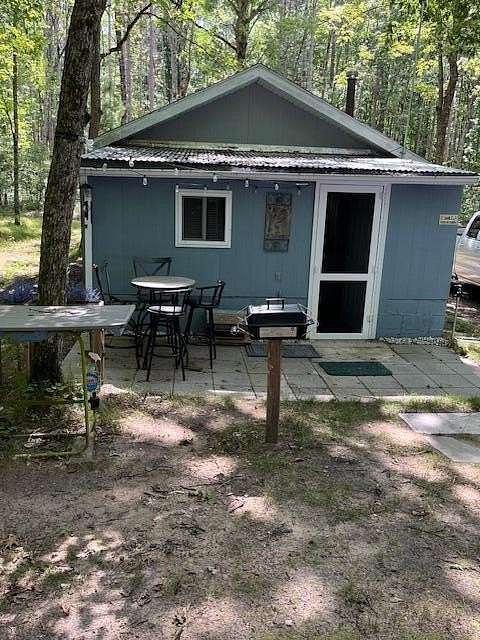 10 Acres of Recreational Land with Home for Sale in Idlewild, Michigan