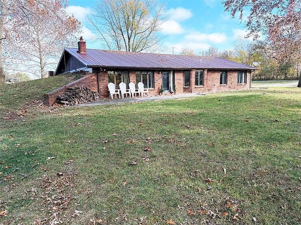 4.9 Acres of Residential Land with Home for Sale in Carthage, Missouri