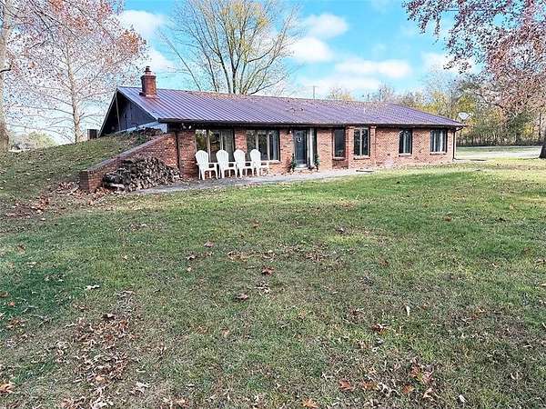 4.9 Acres of Residential Land with Home for Sale in Carthage, Missouri