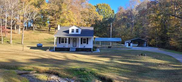 10.7 Acres of Land with Home for Sale in Indian Mound, Tennessee