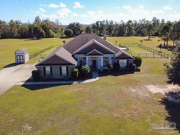 4.13 Acres of Residential Land with Home for Sale in Pace, Florida