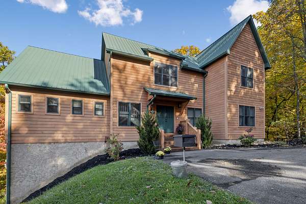 7.15 Acres of Residential Land with Home for Auction in Sevierville, Tennessee