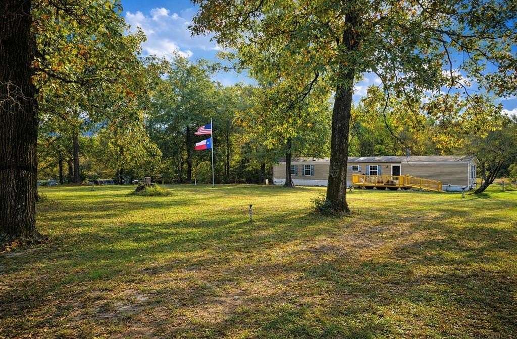 3.5 Acres of Land with Home for Sale in Brookeland, Texas