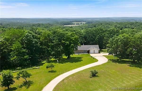 5 Acres of Residential Land with Home for Sale in Iberia, Missouri