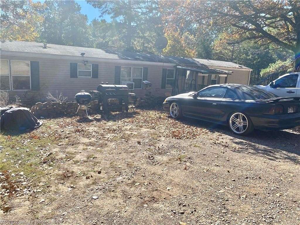 10.3 Acres of Land with Home for Sale in Paris, Arkansas