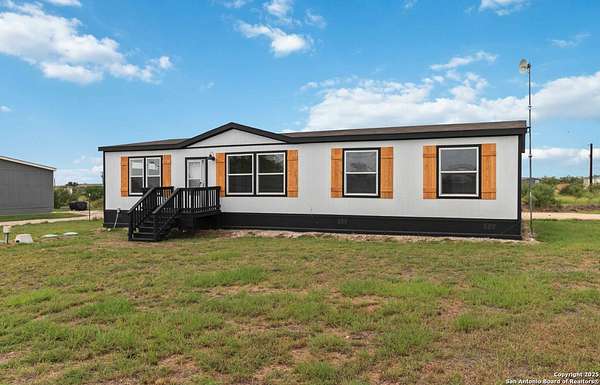 2 Acres of Residential Land with Home for Sale in Bigfoot, Texas