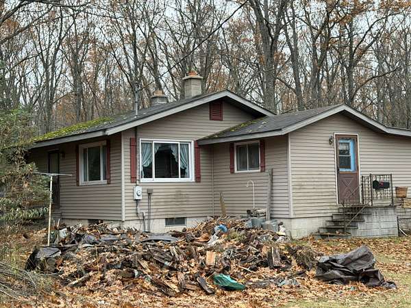 10 Acres of Residential Land with Home for Sale in Hubbard Lake, Michigan