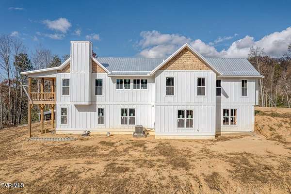 20.1 Acres of Recreational Land with Home for Sale in Roan Mountain, Tennessee