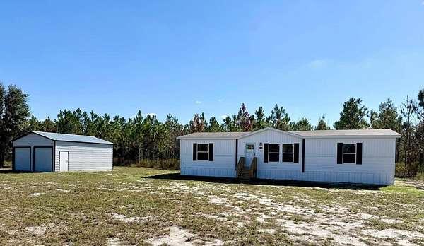 5 Acres of Residential Land with Home for Sale in Live Oak, Florida