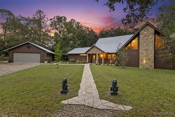 5 Acres of Residential Land with Home for Sale in Inglis, Florida