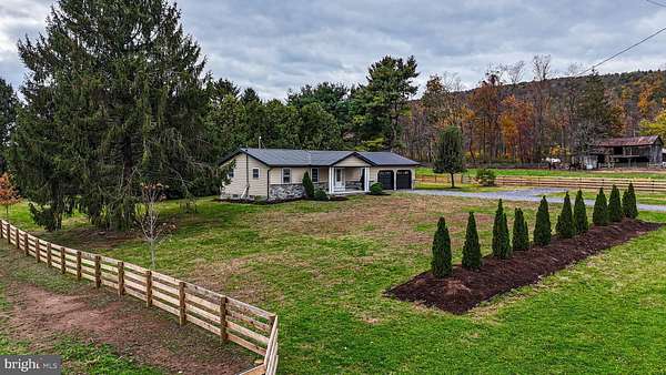 12.4 Acres of Land with Home for Auction in Madisonburg, Pennsylvania