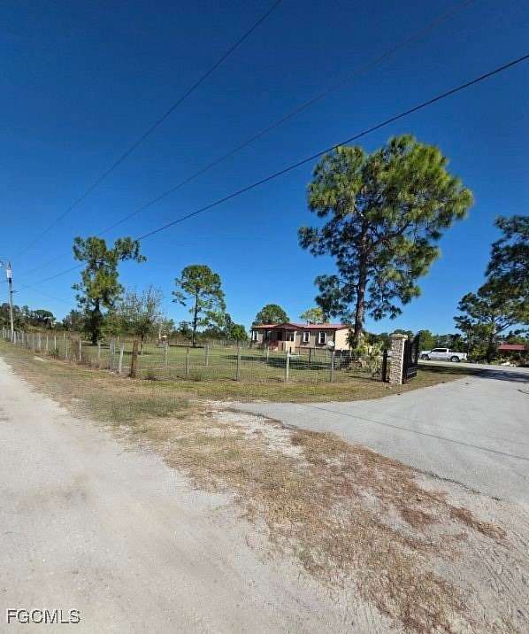 5 Acres of Residential Land with Home for Sale in Lehigh Acres, Florida