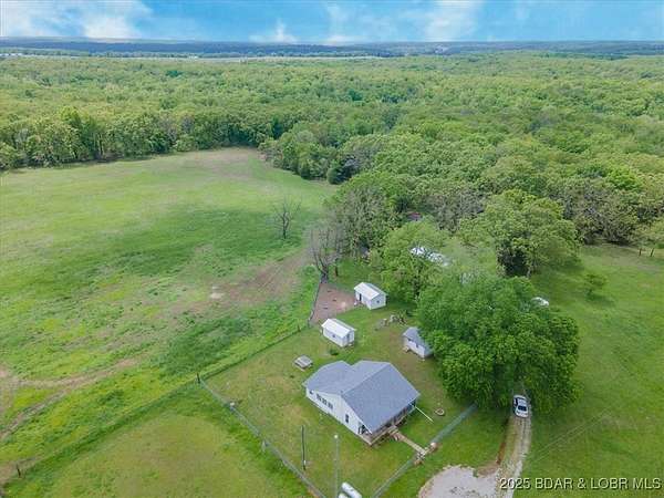 170 Acres of Land with Home for Sale in Linn Creek, Missouri