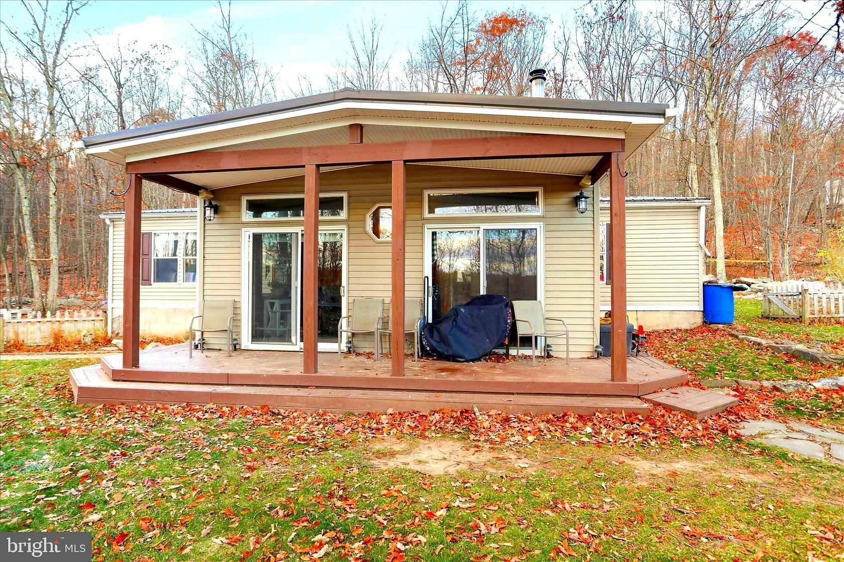 11 Acres of Land with Home for Sale in Great Cacapon, West Virginia