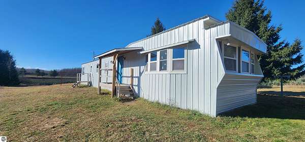 4 Acres of Residential Land with Home for Sale in Lake City, Michigan