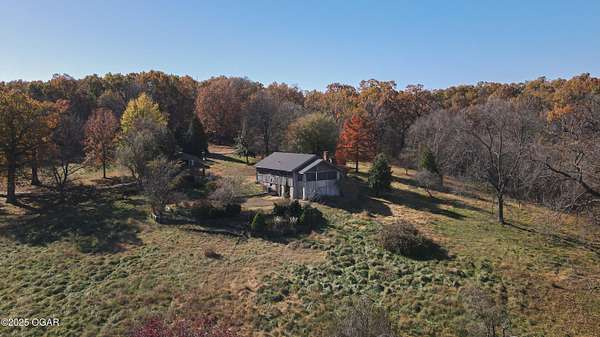 47 Acres of Recreational Land with Home for Sale in Carthage, Missouri