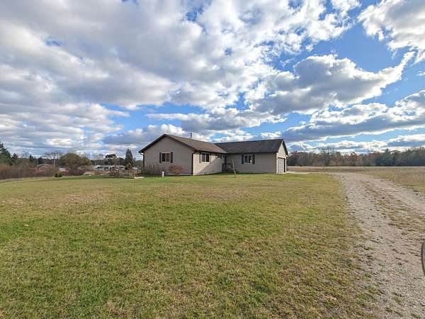 34.9 Acres of Land with Home for Sale in Farwell, Michigan