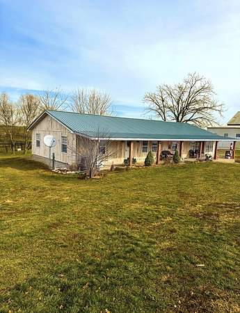 14.9 Acres of Land with Home for Auction in Paris, Kentucky