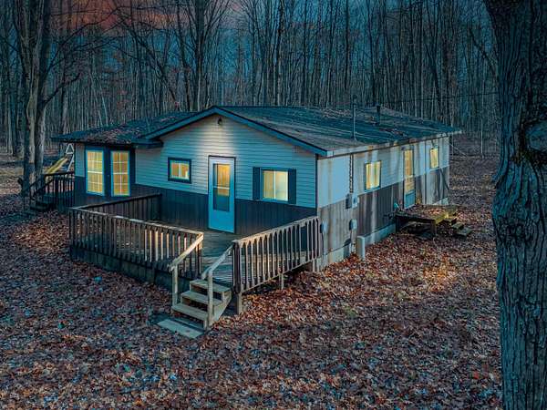 5 Acres of Residential Land with Home for Sale in Beaverton, Michigan