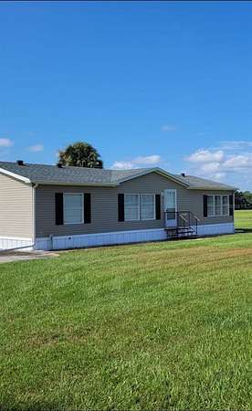 89.2 Acres of Agricultural Land with Home for Sale in Reddick, Florida