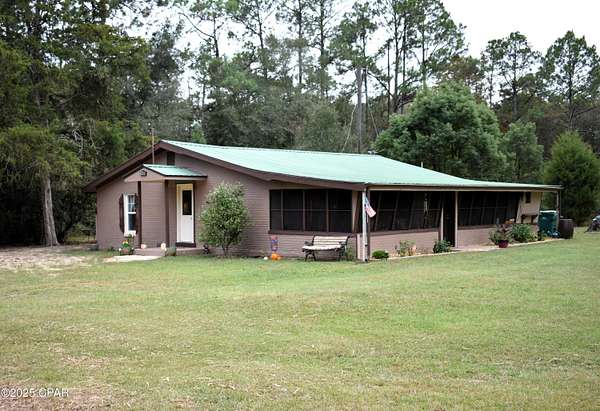 5.1 Acres of Residential Land with Home for Sale in Caryville, Florida