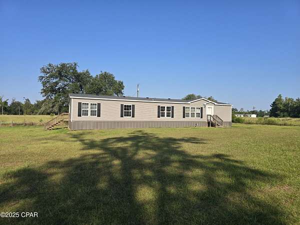 6.8 Acres of Residential Land with Home for Sale in Marianna, Florida