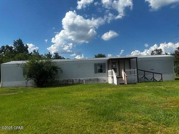 9.47 Acres of Residential Land with Home for Sale in Altha, Florida