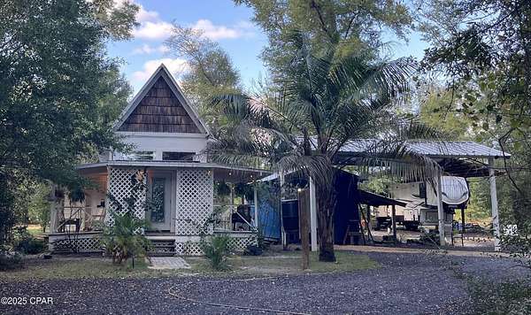 2 Acres of Residential Land with Home for Sale in Altha, Florida