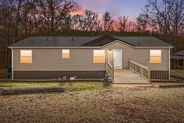 5.87 Acres of Land with Home for Sale in Big Sandy, Tennessee