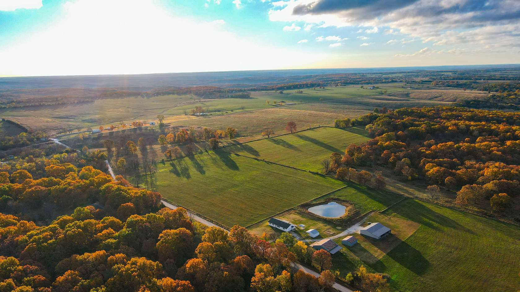108 Acres of Land with Home for Sale in Wheatland, Missouri