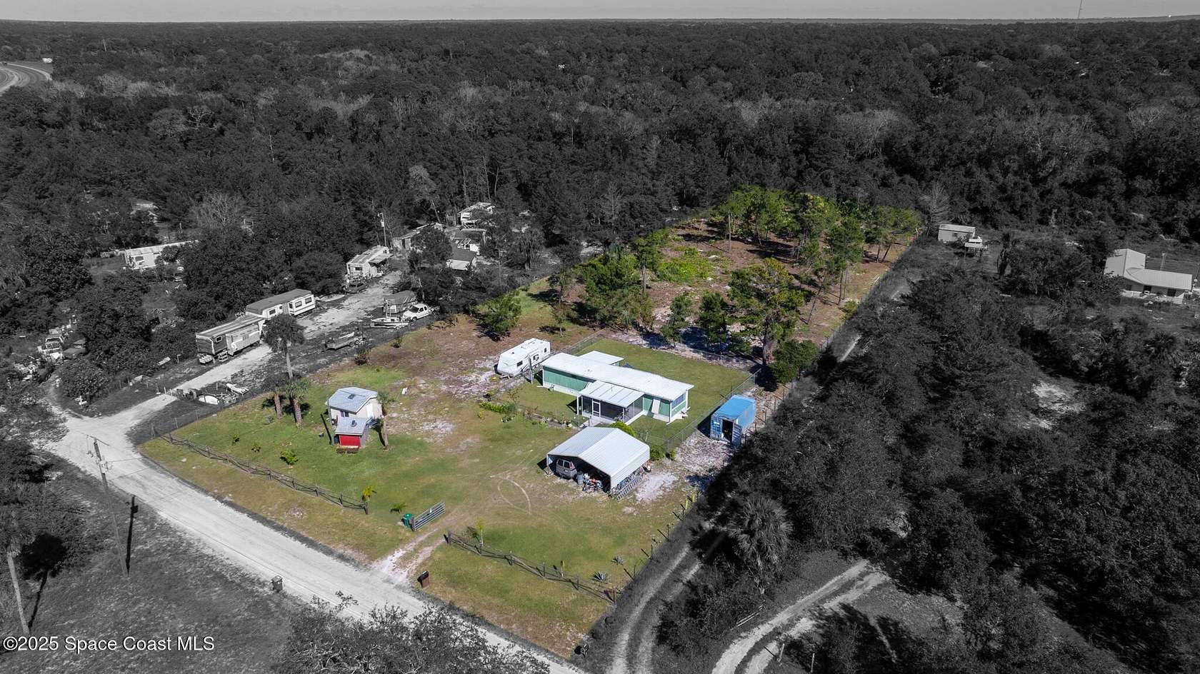 1.69 Acres of Residential Land with Home for Sale in Mims, Florida