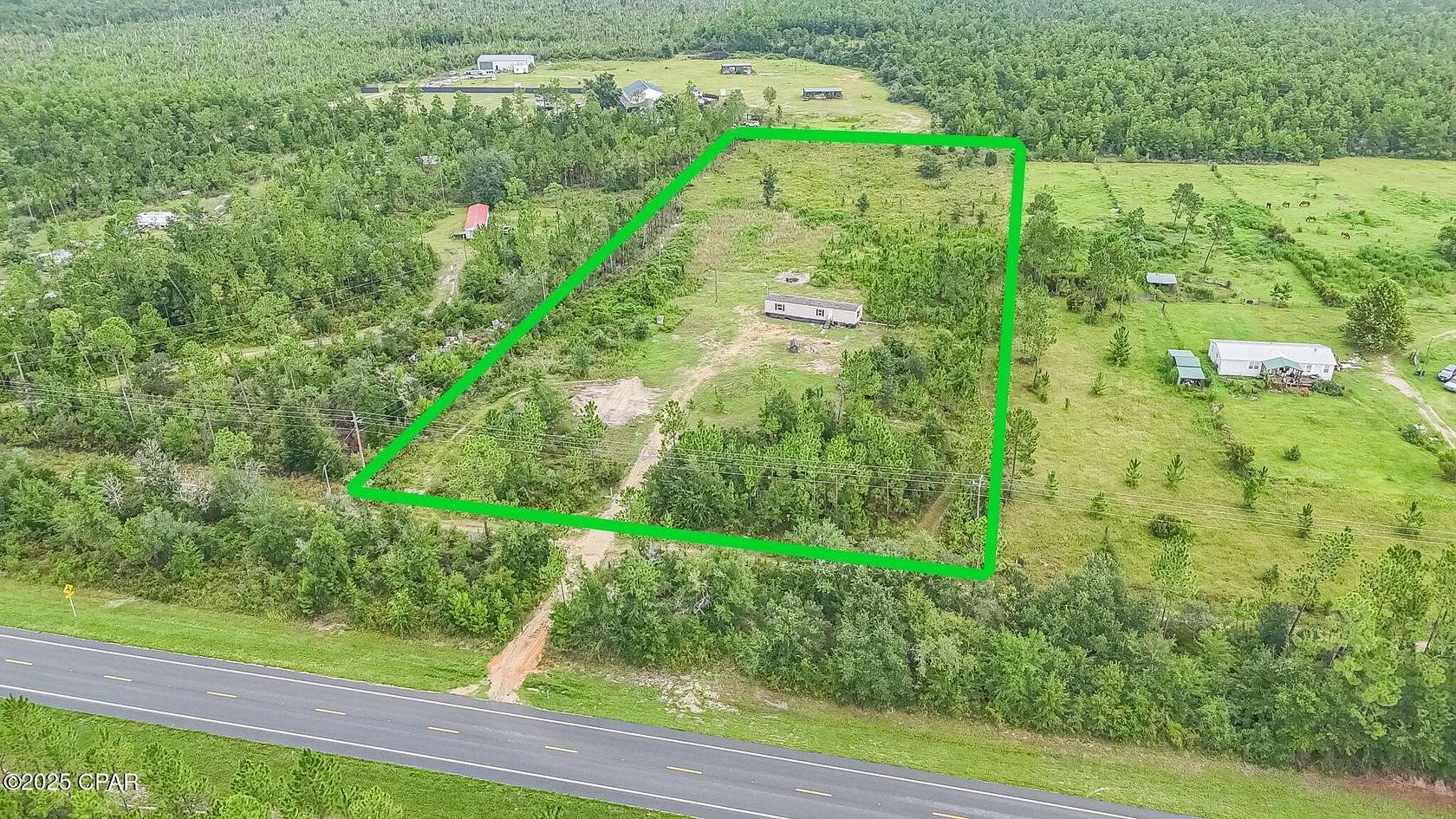 5 Acres of Residential Land with Home for Sale in Youngstown, Florida