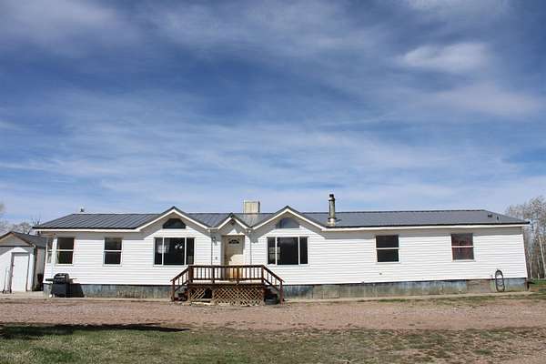 8.56 Acres of Land with Home for Sale in Robertson, Wyoming