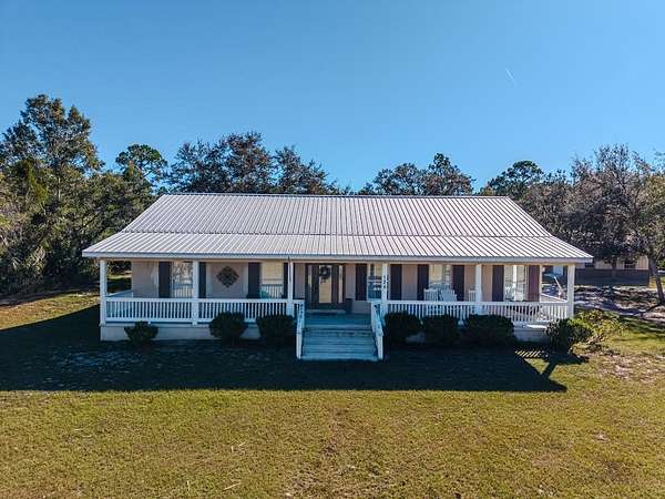 7.57 Acres of Land with Home for Sale in Horseshoe Beach, Florida