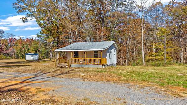 0.5 Acres of Land with Home for Sale in Benton, Tennessee