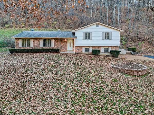 6.69 Acres of Residential Land with Home for Sale in Barnhart, Missouri